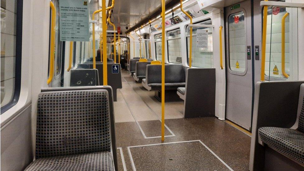 An almost-deserted Tyne and Wear Metro carriage in Newcastle-upon-Tyne