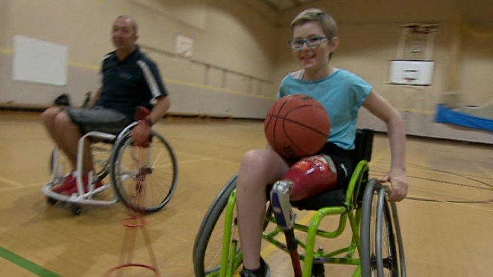 Picture of Mia with her basketball coach