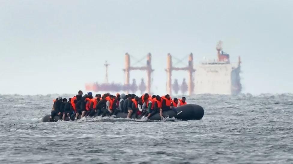 A small boat carrying migrants across the Channel