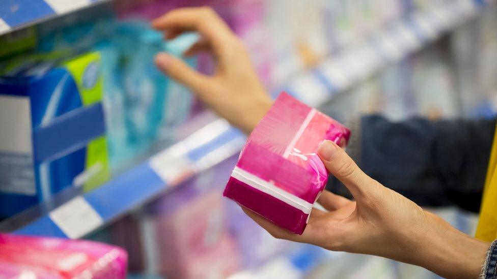 Woman buying period products