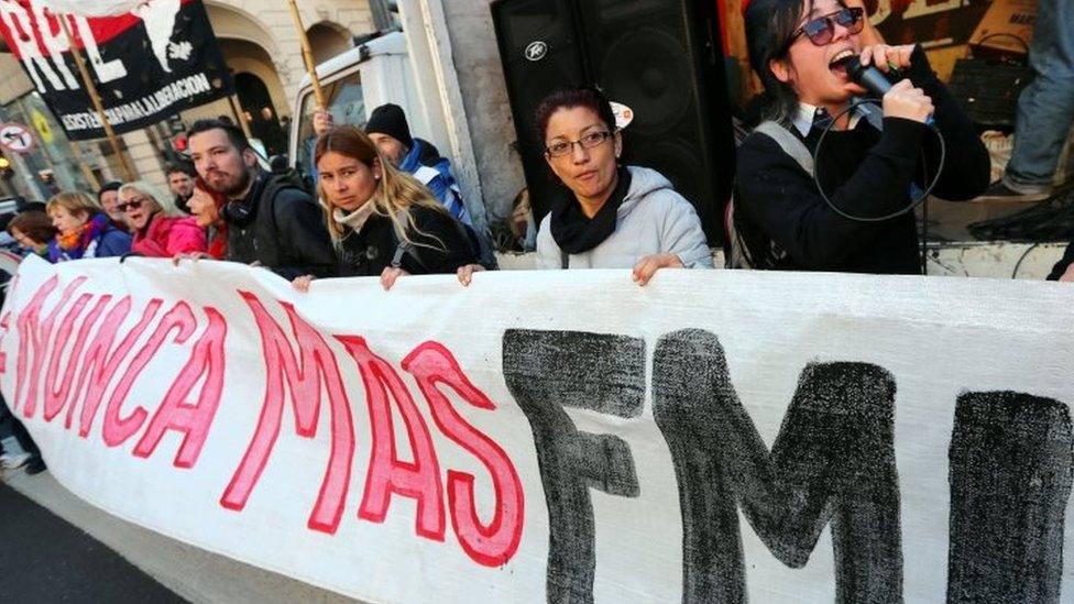 Demonstrators hold a banner that reads "IMF (International Monetary Fund), never again" during a protest against the G20 Meeting of Finance Ministers in Buenos Aires, Argentina, July 21, 2018.