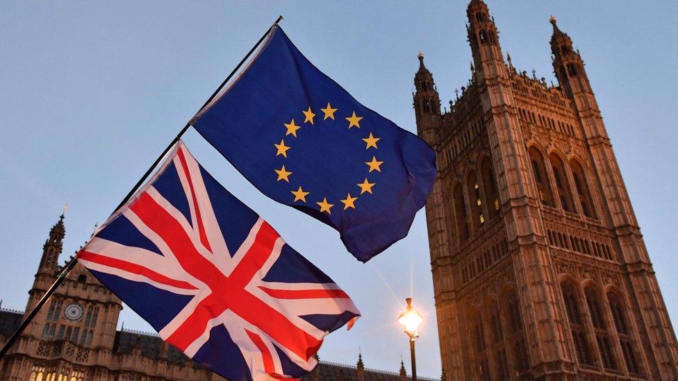 Union and EU flags outside Palace of Westminster