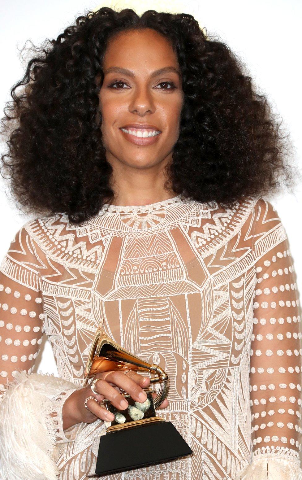 Melina Matsoukas holding a Grammy award