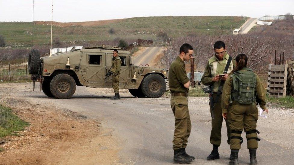 Israeli soldiers block a road near the Israeli border with Syria in the Israeli-occupied Golan Heights, Israel February 10, 2018