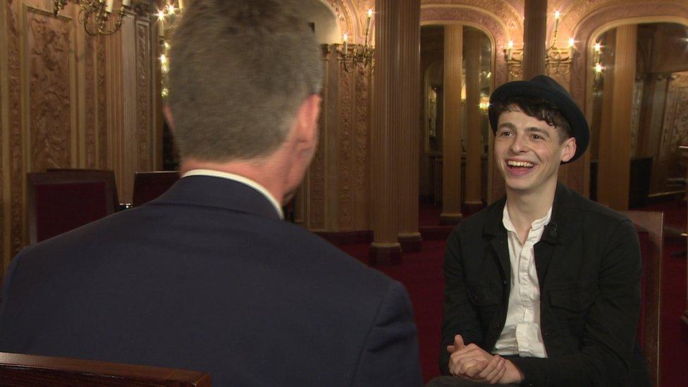 Anthony Boyle being interviewed by BBC News NI's arts correspondent, Robbie Meredith