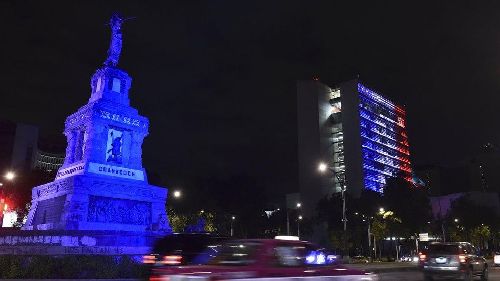 The Mexican Senate building is illuminated with the red, white and blue colors of the French national flag in solidarity with France on November