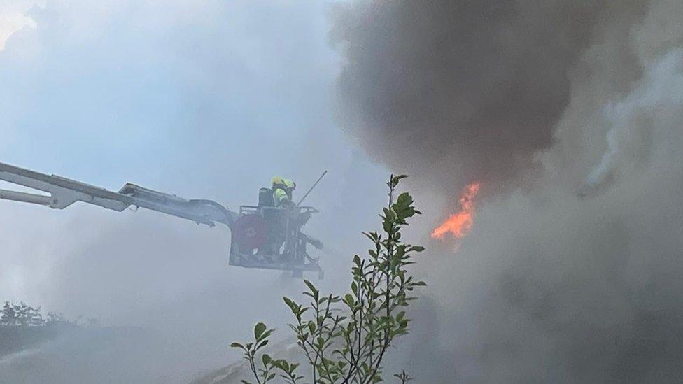 Firefighters working to put out the fire