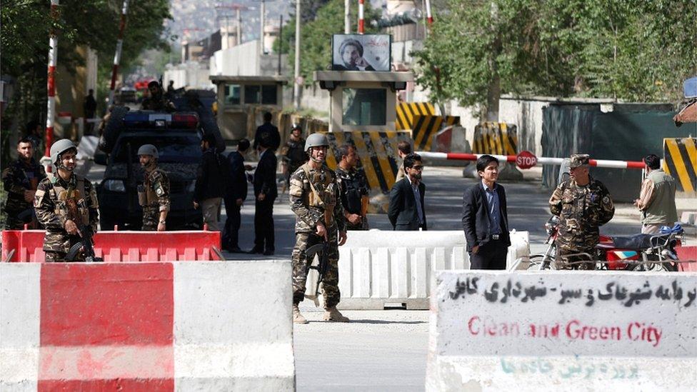 Afghan security forces stand guard near the site of a blast in Kabul on 30 April 2018