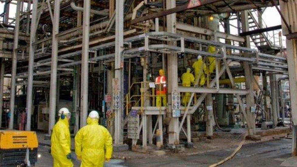 Workers at a chemical plant