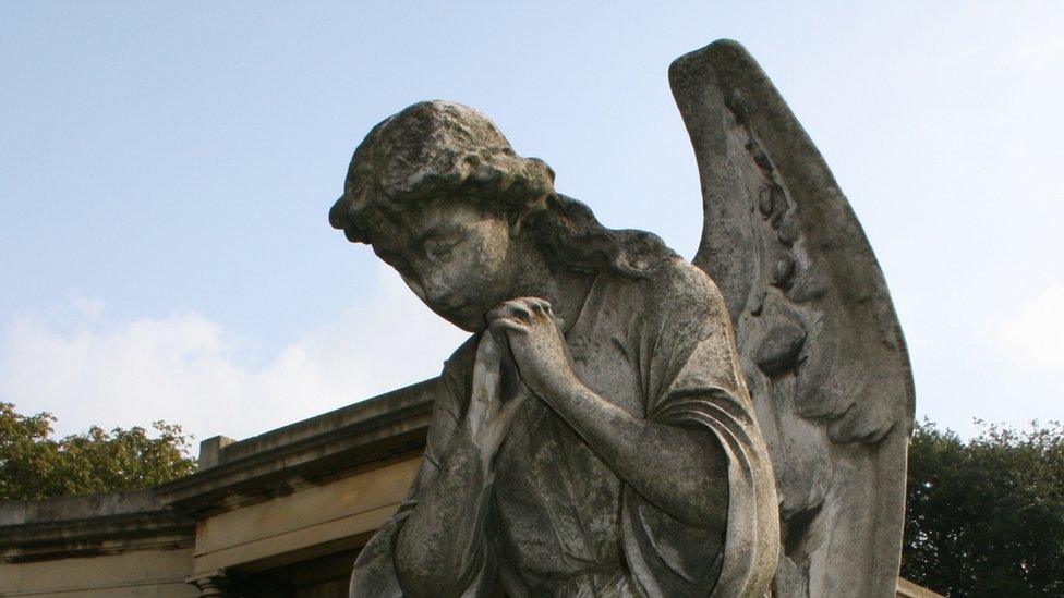 Statues of an angel in London's Brompton Cemetery