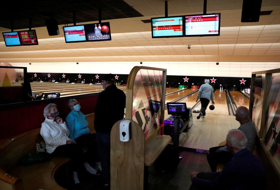 Members of the Durham Strikes Bowling team enjoy a game at Hollywood Bowling alley following the easing of coronavirus disease (COVID-19) restrictions in Washington, 17 May 2021.