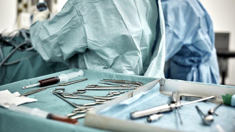 Close-up of surgical equipment in tray at hospital - stock photo