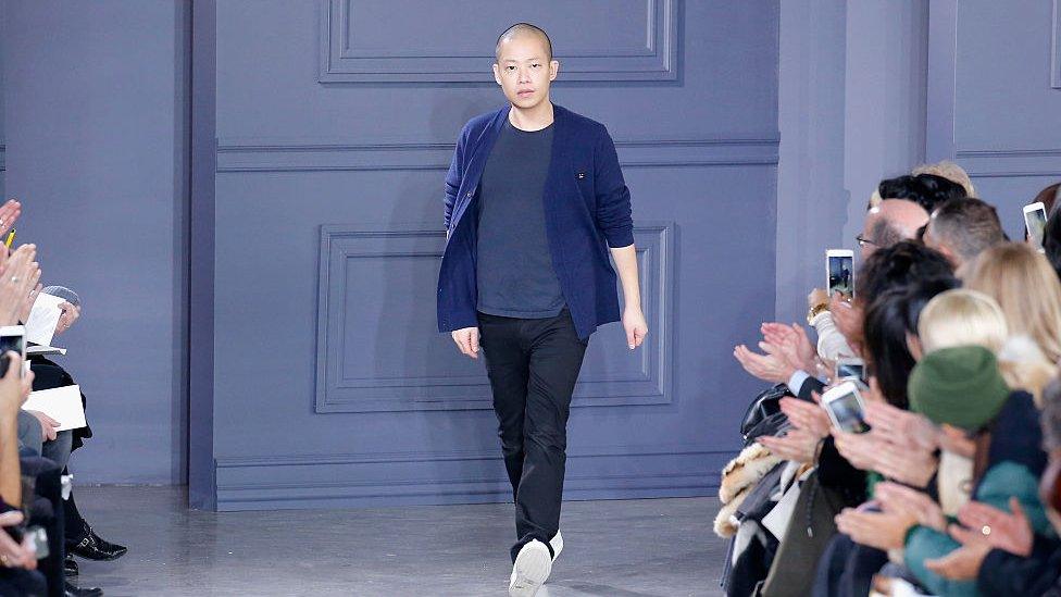 Designer Jason Wu greets the audience from the runway at Jason Wu Fall 2016 during New York Fashion Week at Spring Studios on February 12, 2016 in New York City