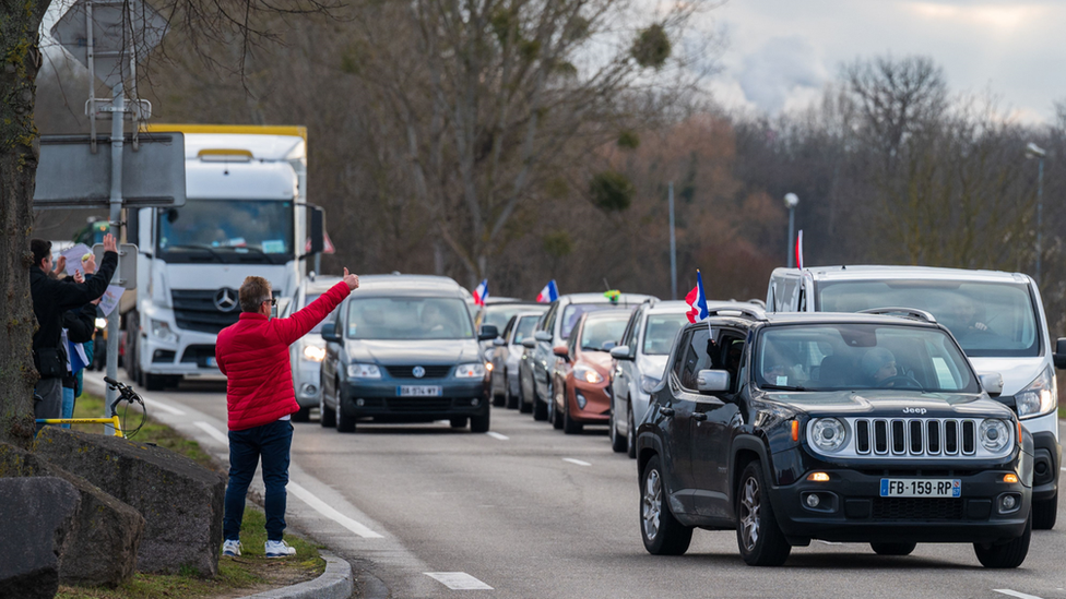 Supporters of the Freedom Convoy cheer participants leaving Strasbourg, north-eastern France. Photo: 11 February 2022