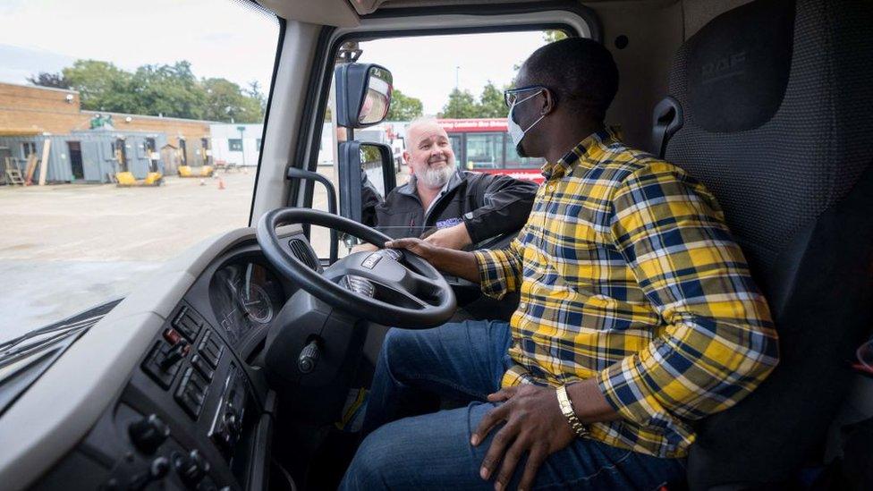 A lorry driver being trained in the UK