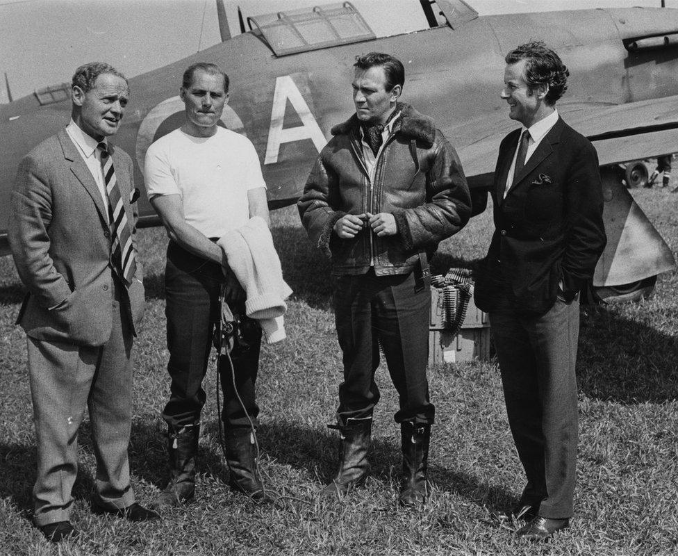 Actors Robert Shaw (second left) and Christopher Plummer (second right) took time out from shooting to talk to pilots Group Captain Bade (left) and Group Captain Peter Townsend (right) in May 1968.