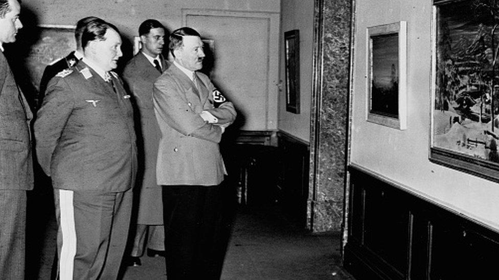 Hermann Goering and Adolph Hitler examine a painting at what is probably the exhibit "Entartete Kunst" (Degenerate Art) put together by the Nazi party intending to illustrate that many artists were unworthy of the "higher race".