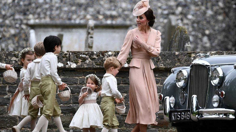 Duchess of Cambridge walks with the flower boys and girls