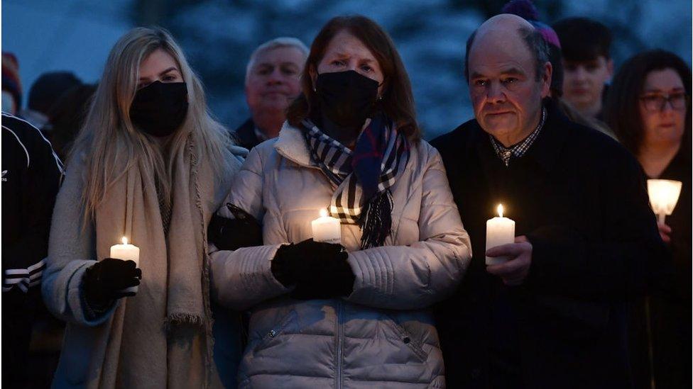 Murdered school teacher Ashling Murphy's mother Kathleen Murphy , father Raymond Murphy and sister Amy Murphy comfort one another as they attend a candle lit vigil near the scene of her murder