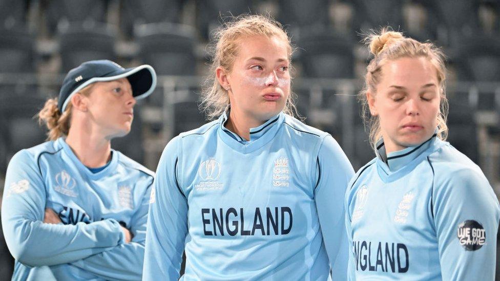 Heather Knight, Sophie Ecclestone and Freya Davies of England look dejected