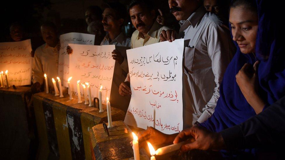 Christians in Pakistan light candles for those hurt and killed in the eight attacks.