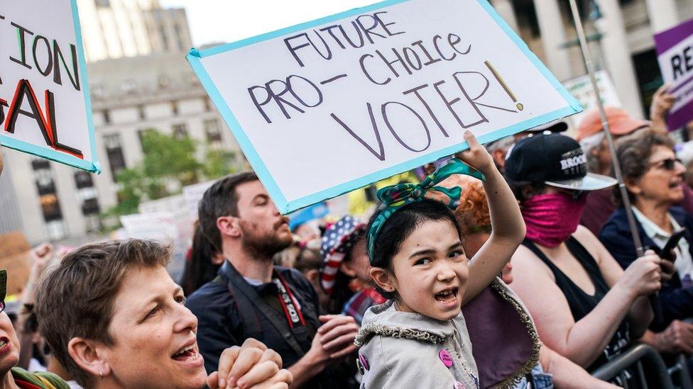 Abortion-rights campaigners attend a rally against in New York City