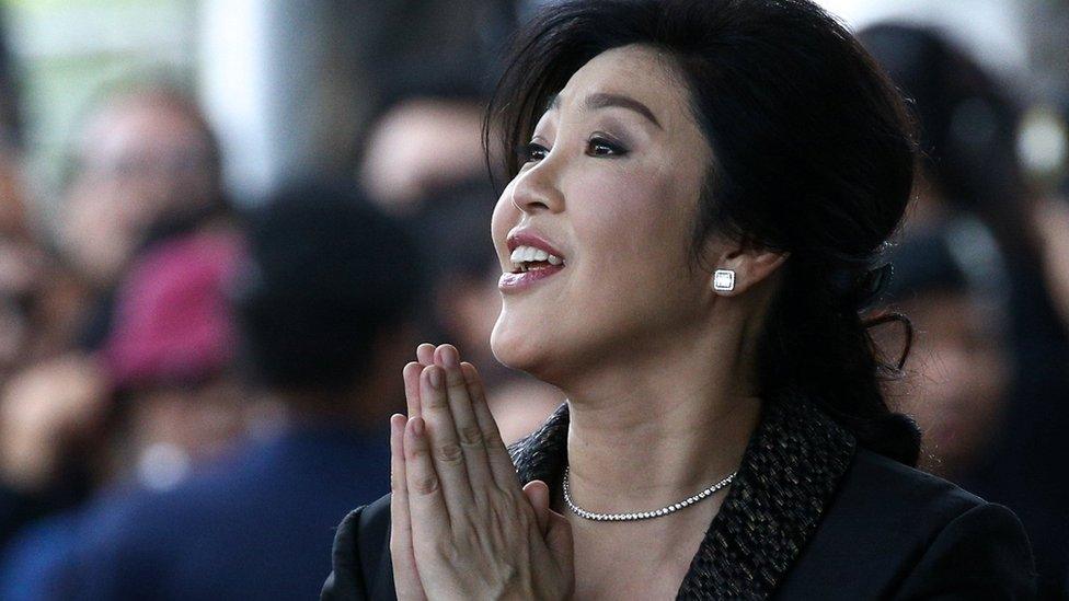 Yingluck Shinawatra greets supporters as she arrives at the Supreme Court in Bangkok, Thailand, August 1, 2017