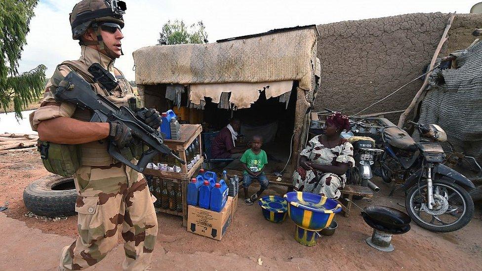 A French soldier involved in the regional anti-insurgent Operation Barkhane patrols on March 9, 2016 at the Port de Korioume near Timbuktu. France's Barkhane counter-terror mission comprises at least 3,500 soldiers deployed across five countries (Mauritania, Mali, Niger, Chad and Burkina Faso) with a mandate to combat jihadist insurgencies in the region