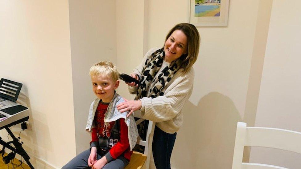 Kat Trelawny cutting her son's hair