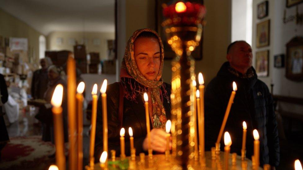 Woman praying in church