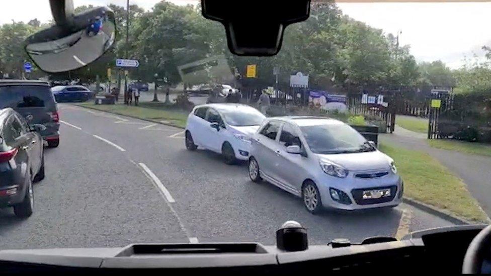 Cars blocking yellow school road markings