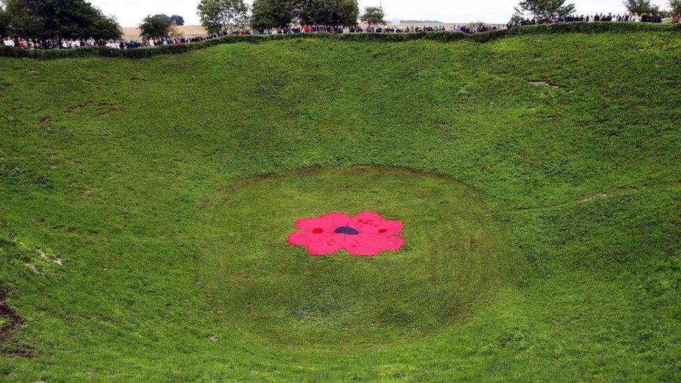 People standing around the Lochnagar Crater