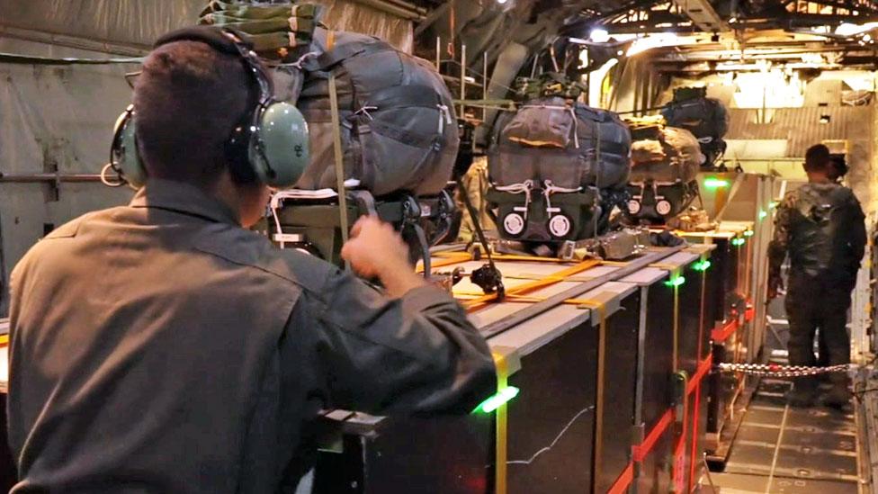 Soldiers on board a Jordanian Air Force plane over Gaza