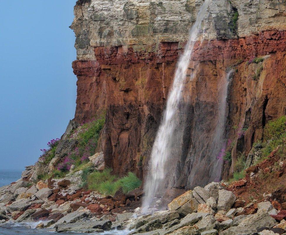 The water coming off the clifftops in Hunstanton, like a waterfall