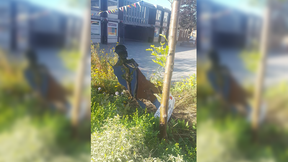 Image of damaged metal soldier statue in Daniel Owen Square