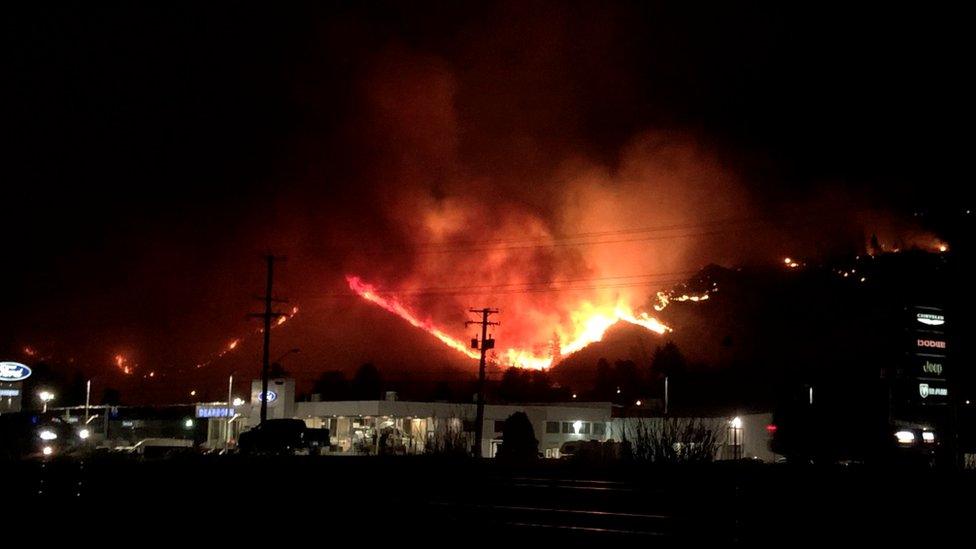 Flames rise as a wildfire burns on a hill in Kamloops, British Columbia, Canada, 1 July 2021