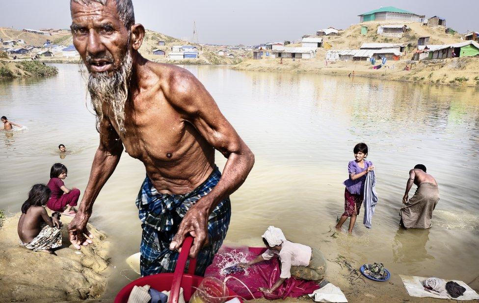 A man comes out of bathing in a river