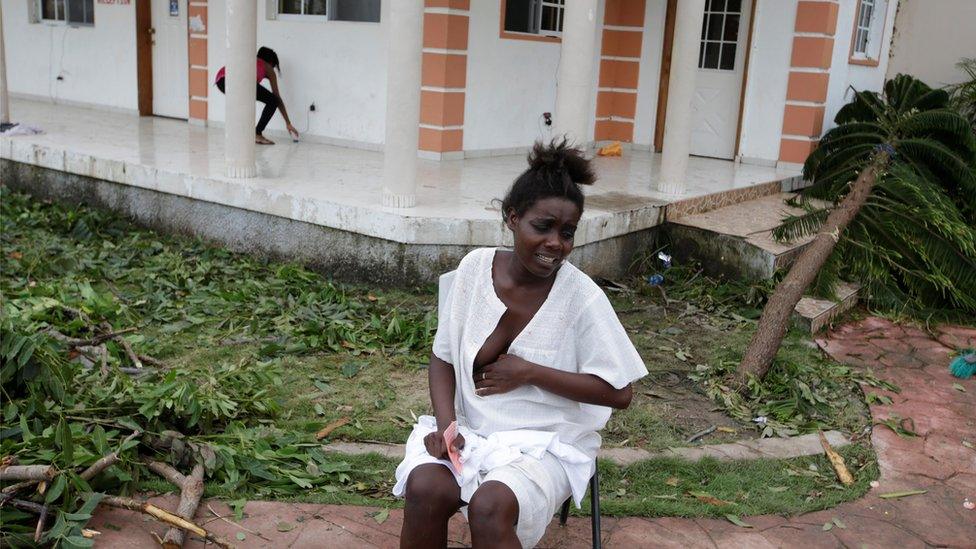 Emma Etienne waits to find a doctor to deliver her baby at temporary shelter Hotel Villa Mimosa following Hurricane Matthew in Les Cayes, Haiti