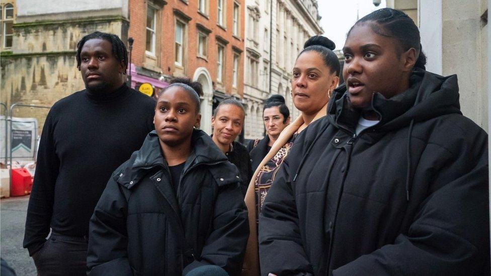 A group of people standing outside Bristol Crown Court