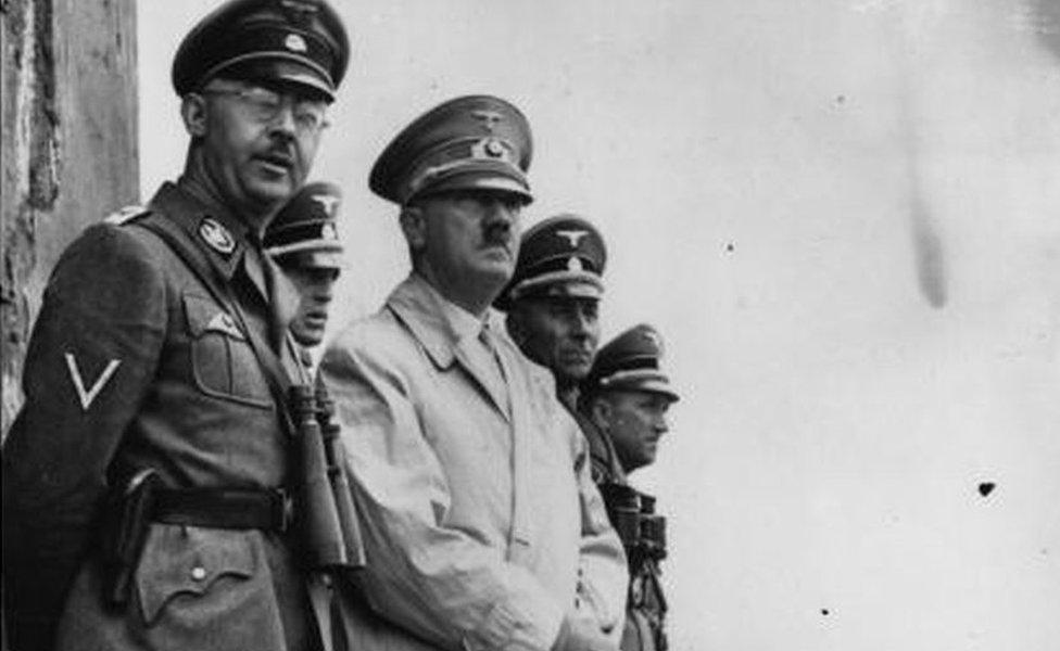 German dictator Adolf Hitler and German Nazi leader and chief of police Heinrich Himmler (left) watching Stormtroop manoeuvres.