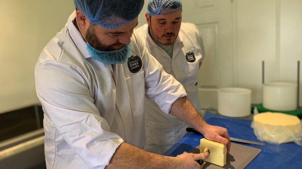 Mr Thomas and Mr Rowlands preparing cheese