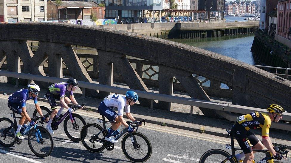 Cyclists crossing a bridge over River Orwell in Ipswich