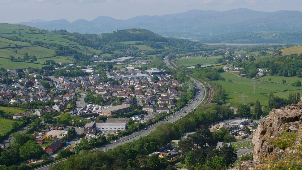 The A55 by Mochdre village and a view of the Snowdonia mountains