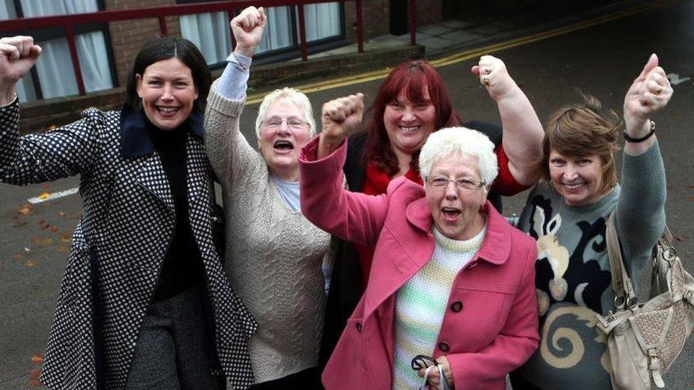 Workers celebrate their victory