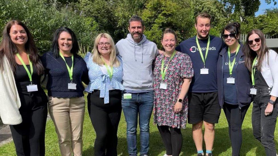 Photo of Crossroads charity workers in a garden