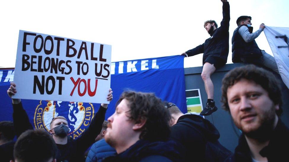 Fans protest the European Super League outside Stamford Bridge