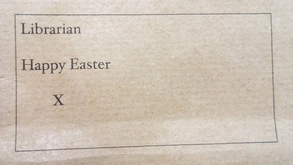 A brown envelope with the words "Librarian Happy Easter X" printed on it