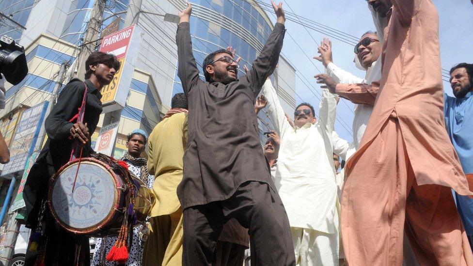 Supporters of opposition party Pakistan Muslim League Nawaz (PMLN) celebrate in Multan