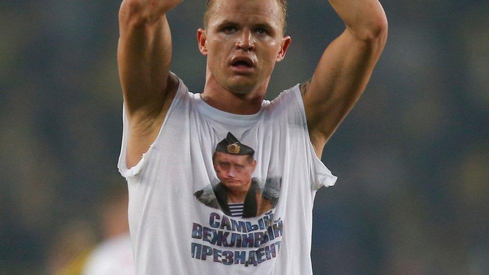 Locomotiv Moscow"s Dmitri Tarasov features an inner shirt with a picture of Russian President Vladimir Putin in Istanbul, Tuesday, Feb. 16, 2016