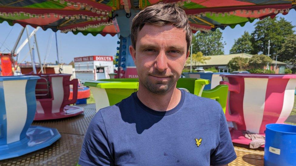 Funfair owner George Scarrott standing in front of the teacups